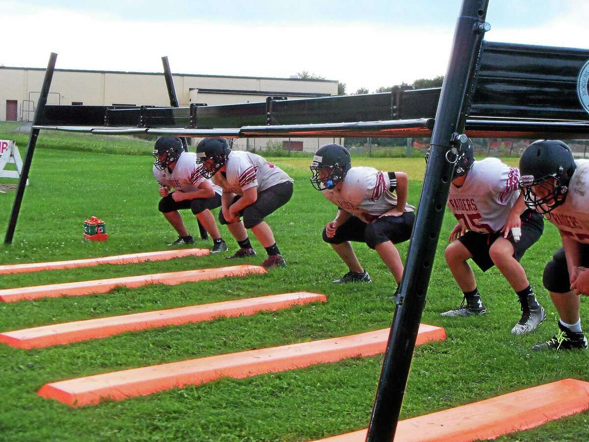 Torrington linemen get ready to take part in a drill this offseason.