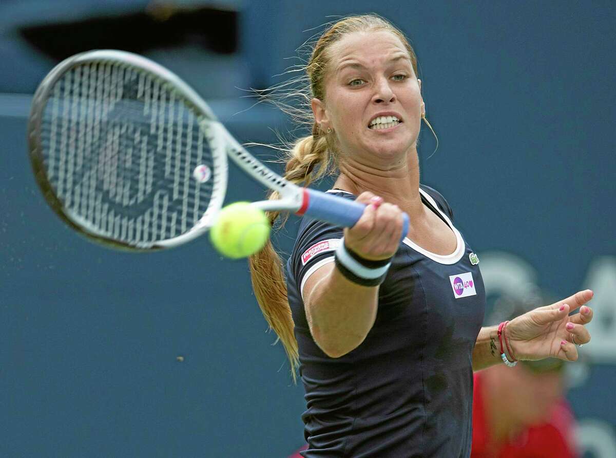 Dominika Cibulkova of Slovakia hits a forehand to Angelique Kerber of Germany during their Rogers Cup women's tennis match in Toronto on Tuesday, Aug. 6, 2013. (AP Photo/The Canadian Press, Frank Gunn)