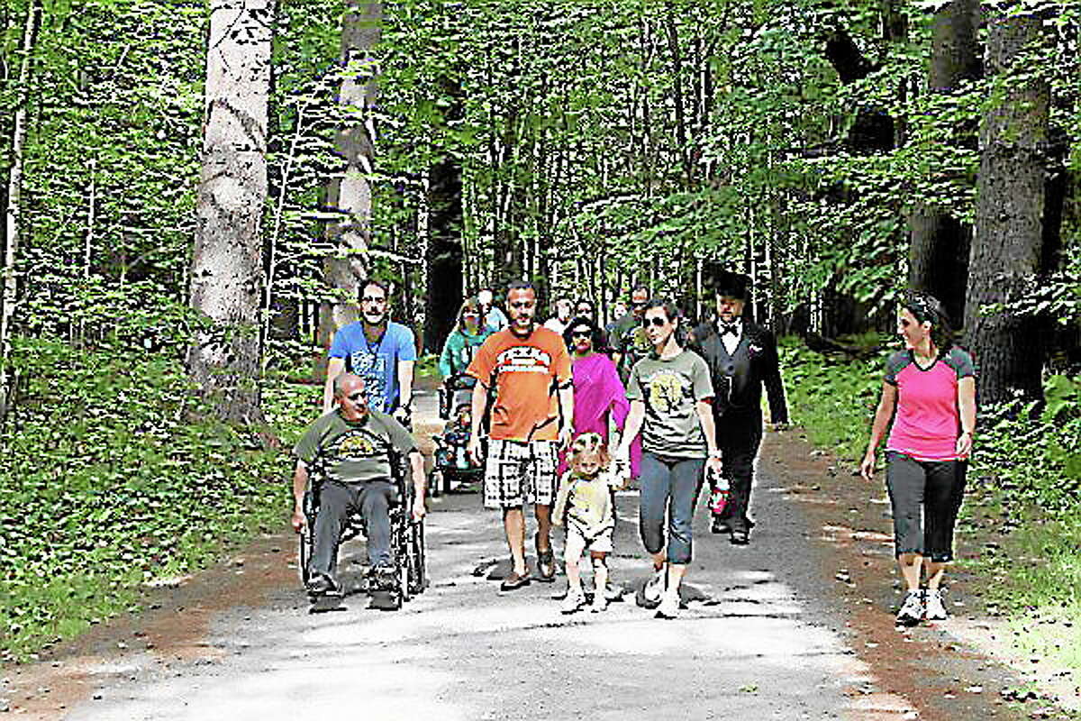 Walkers take part in last year’s “Walk in the Woods” in Litchfield.