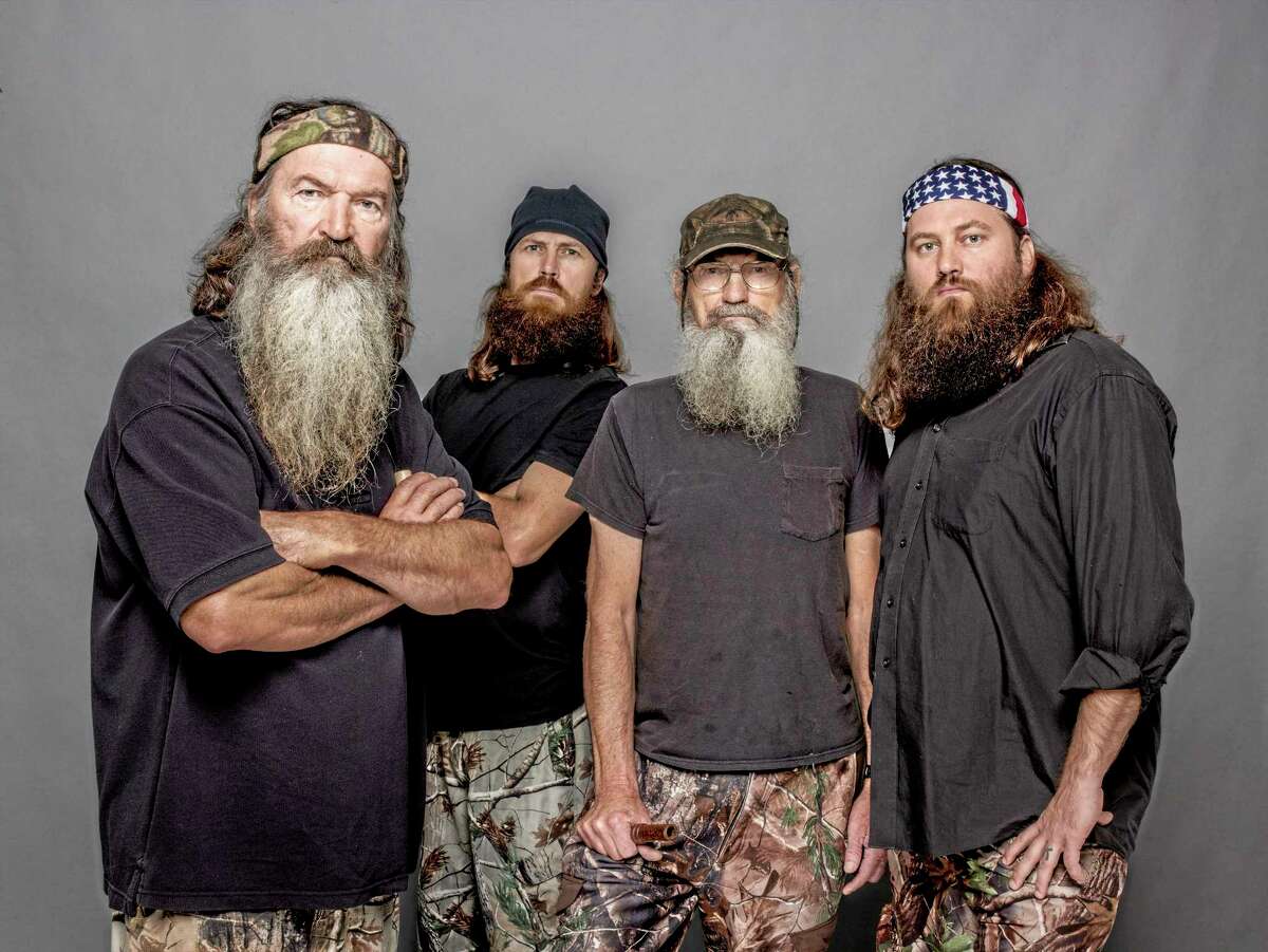 This 2012 photo released by A&E shows, from left, Phil Robertson, Jase Robertson, Si Robertson and Willie Robertson from the A&E series, "Duck Dynasty." A&E says nearly 12 million birds of a feather caught the season premiere of the hit unscripted series on Wednesday, Aug. 14, 2013. (AP Photo/A&E, Zach Dilgard)