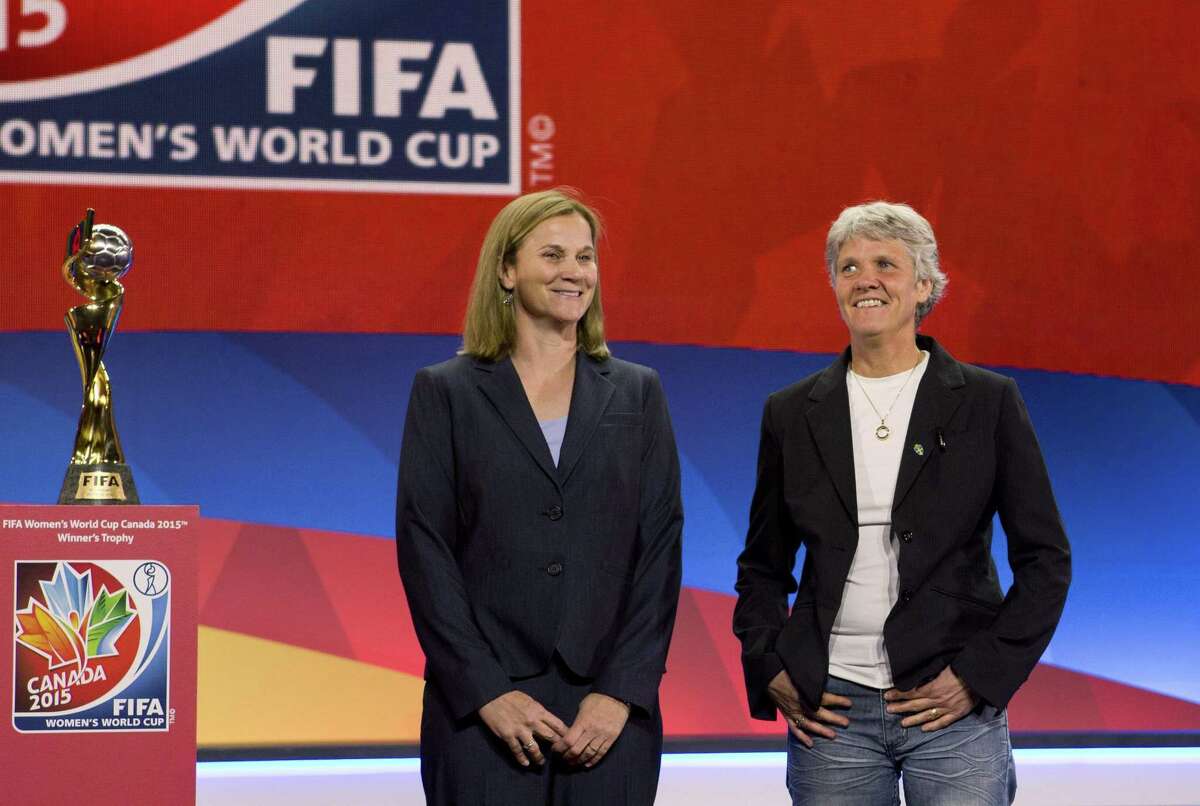 USA national team coach Jill Ellis, left, and Sweden coach Pia Sundhage pose Saturday in Gatineau, Quebec, after the FIFA Women’s World Cup draw.