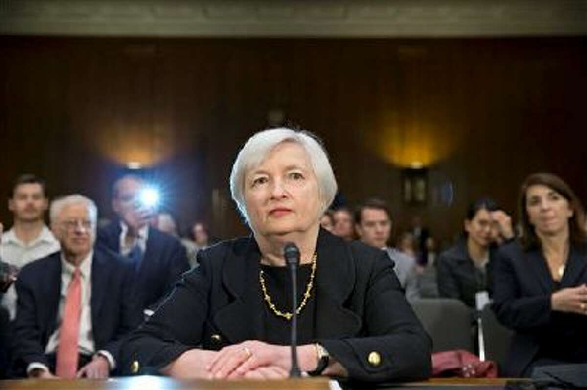 Janet Yellen, President Obama's nominee to succeed Ben Bernanke as Federal Reserve chairman, defends the Fed's stimulus policies as she testifies at her confirmation hearing before the Senate Banking Committee, on Capitol Hill in Washington, Thursday, Nov. 14, 2013. Yellen, 67, is expected to be confirmed by the Democratic-controlled Senate before Bernanke steps down in January. (AP Photo/J. Scott Applewhite)