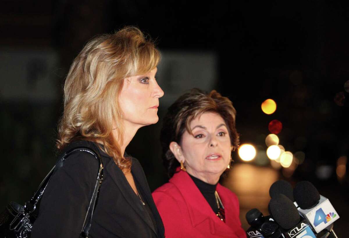 Judy Huth, left, appears at a press conference with attorney Gloria Allred outside the Los Angeles Police Department's Wilshire Division station Friday Dec. 5, 2014. Allred announced that they have met with Los Angeles police detectives to open a formal investigation into claims Bill Cosby molested Huth when she was 15 years old in a bedroom of the Playboy Mansion. (AP Photo/Anthony McCartney)