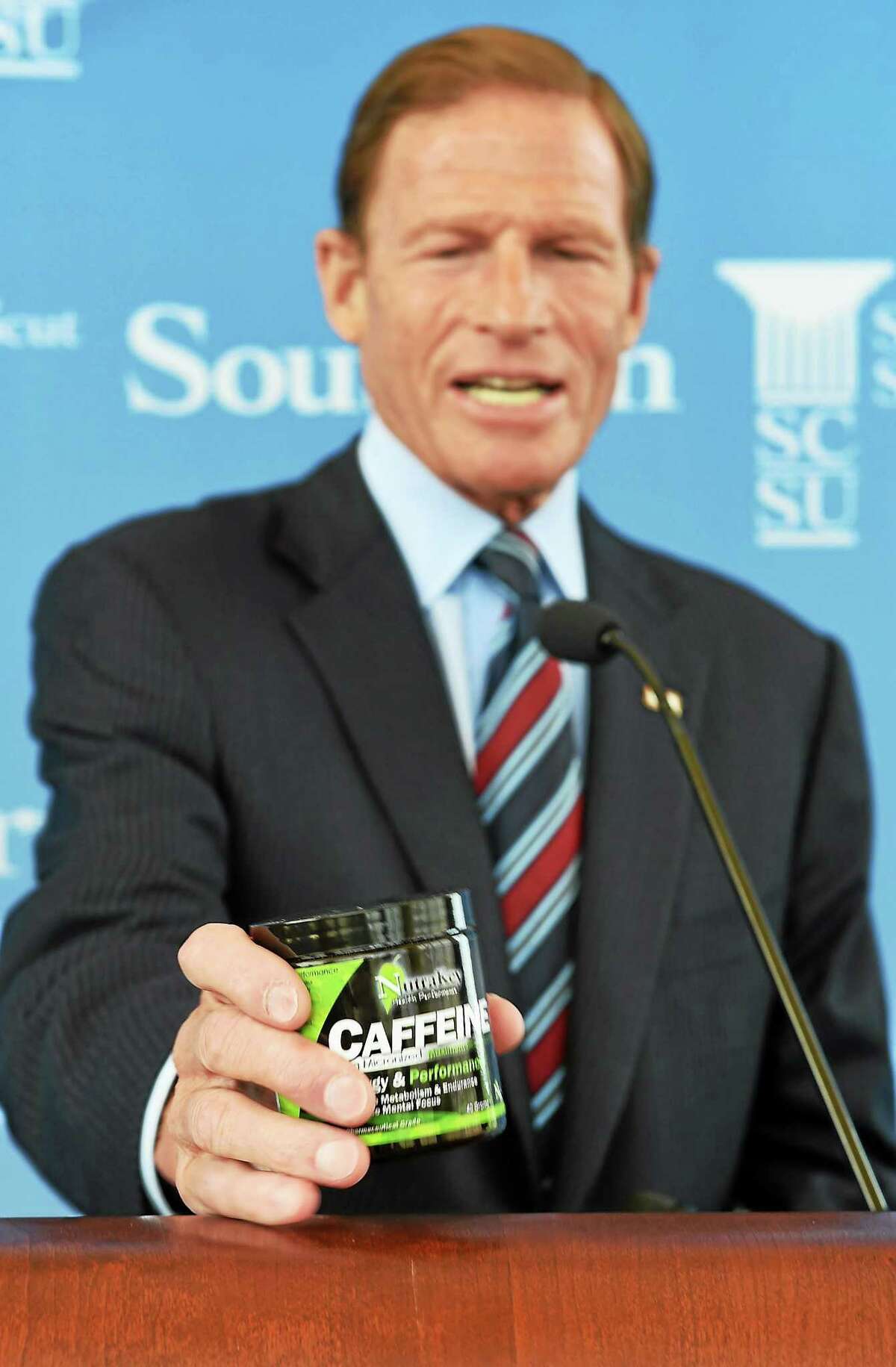 U.S. Senator Richard Blumenthal holds an example of the powdered caffeine he is asking the FDA to remove from store shelves on August 21, 2014.