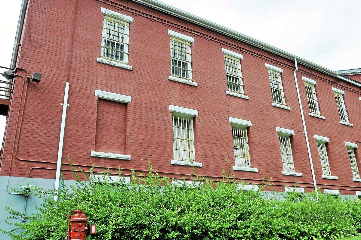 Bars are seen on the windows of the former Litchfield jail, located at 7 North St., which was sold by the state to a local developer Wednesday.