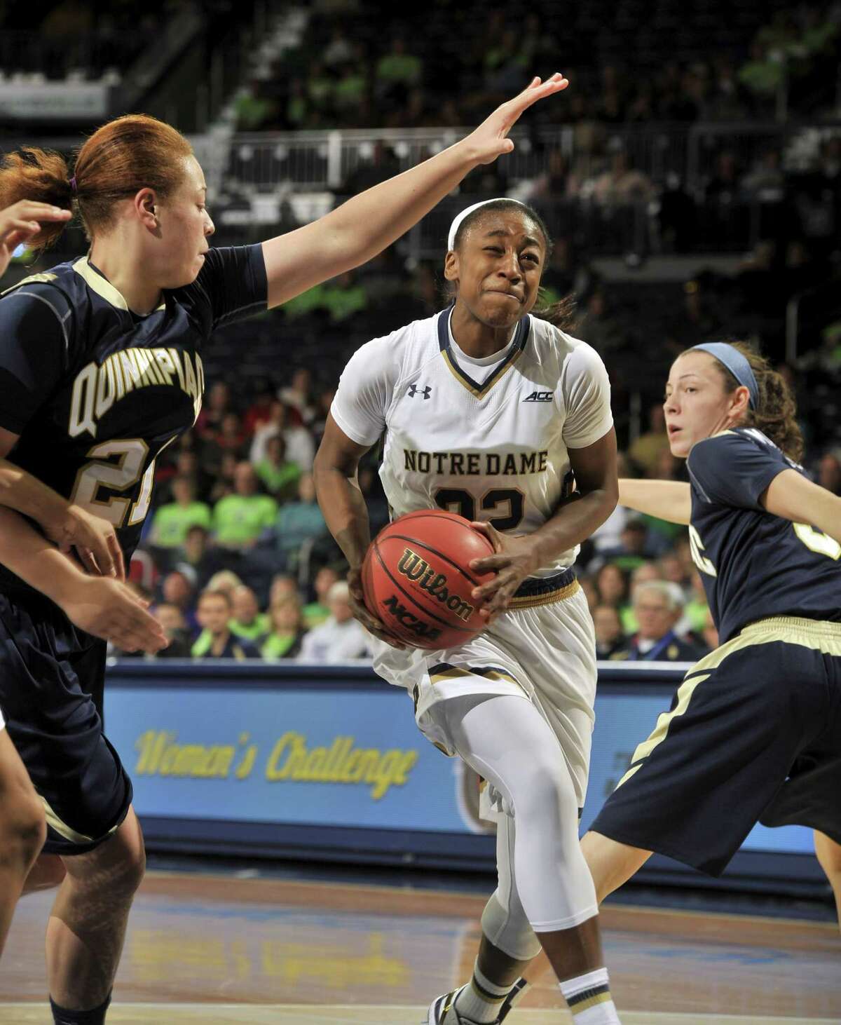Notre Dame guard Jewell Loyd drives the lane between Quinnipiac guards Jennifer Fay, left, and Adily Martucci in the second half of a Nov. 25 game in South Bend, Ind.