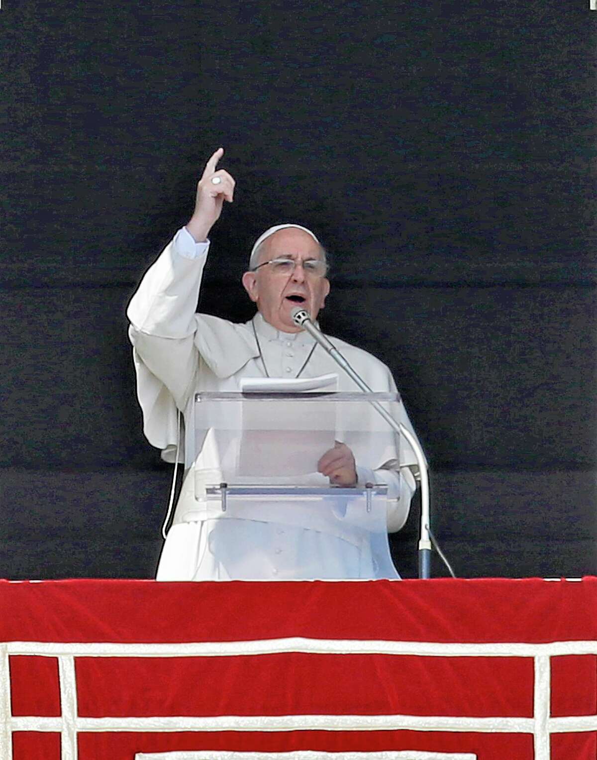 Pope Francis delivers his message on the occasion of the Angelus noon prayer in St. Peter's Square, at the Vatican, Sunday, March 16, 2014. (AP Photo/Gregorio Borgia)