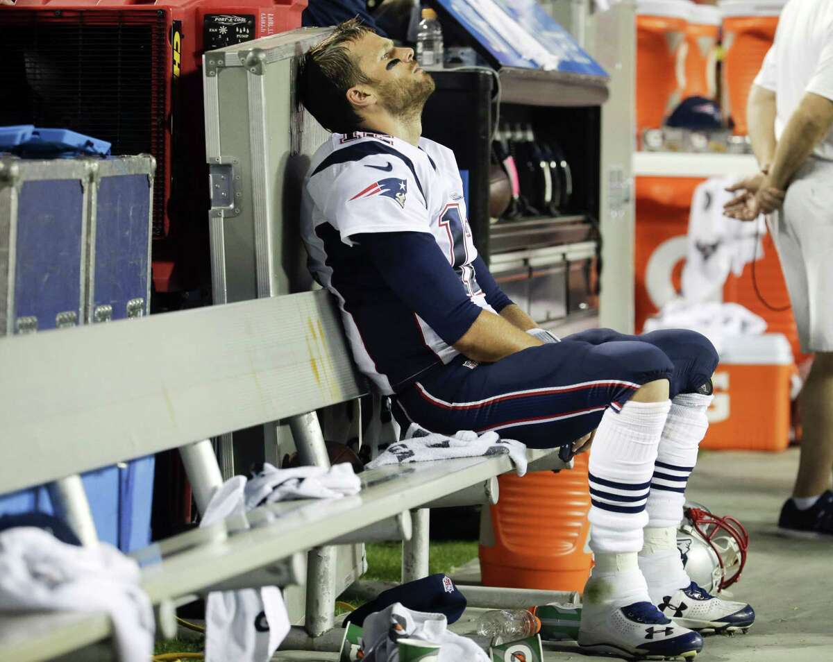 New England Patriots quarterback Tom Brady sits on the bench during the fourth quarter of a Sept. 29 game against the Chiefs in Kansas City, Mo.