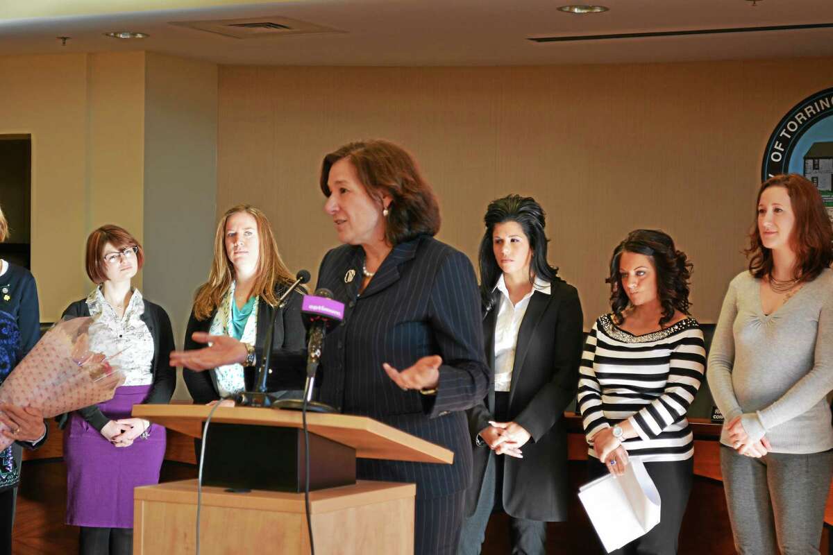 Jenny Golfin - Register Citizen. Mary Barneby, CEO of Girl Scouts of Connecticut says a few words after the Girl Scouts of Connecticut are announced as the recipient of the award for Best Supporting Organization in the Role of Empowering Women. Behind her are the members of the United Way's Women's Leadership Initiative. Gail Olsen the co-chair of the Women's Leadership Initiative holds flowers to present to Barneby.