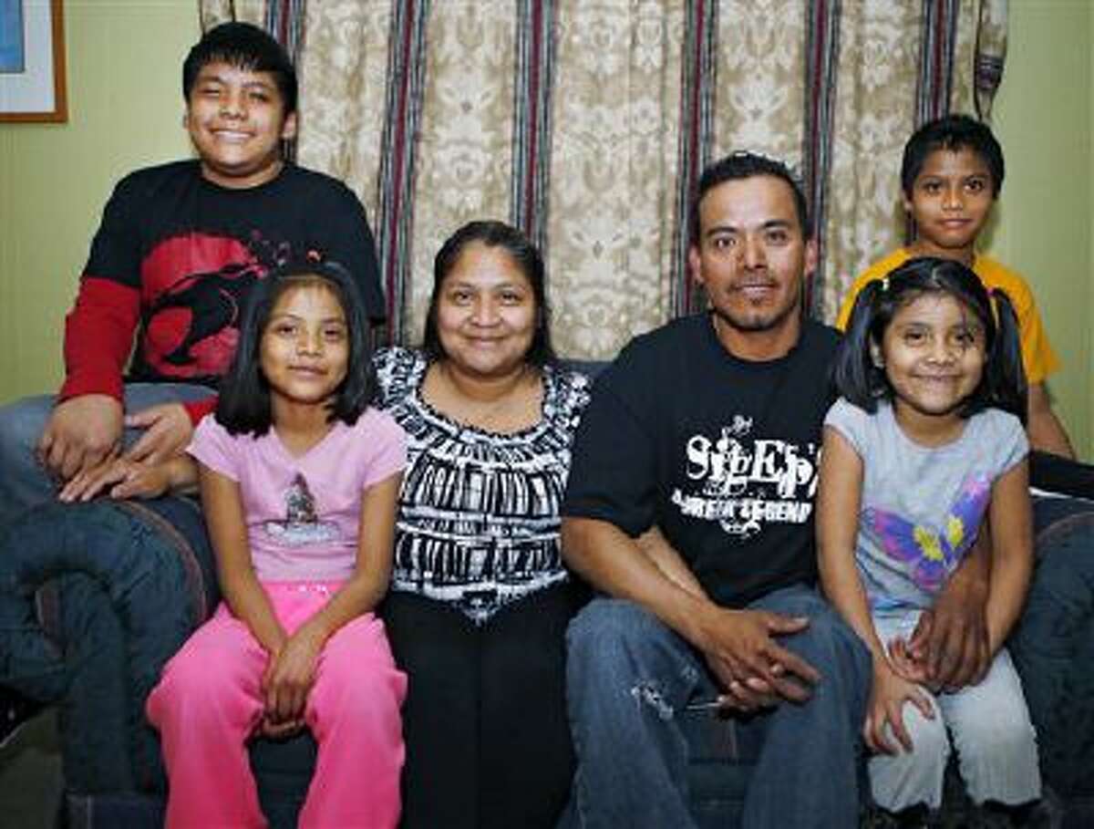 This photo taken Feb. 6, 2014, shows Abel Bautista and his wife Guadalupe posing with their four children at their home in Thornton, Colo. From left are, Kolby, 12, Wendy, 8, Guadalupe, 32, Able, 37, Kimbereli, 7, and Able, 10. Abel Bautista and his wife entered the U.S. illegally decades ago, and have been fighting deportation ever since a traffic stop in September of 2012. Their next hearing is in October and Bautista is hoping for action from DC. Citizenship is far from his mind.?We?re just left dangling,? Bautista said. ?It?s better for each person to have citizenship, but first stop the deportations, because it?s affecting so many families.? (AP Photo /Ed Andrieski)