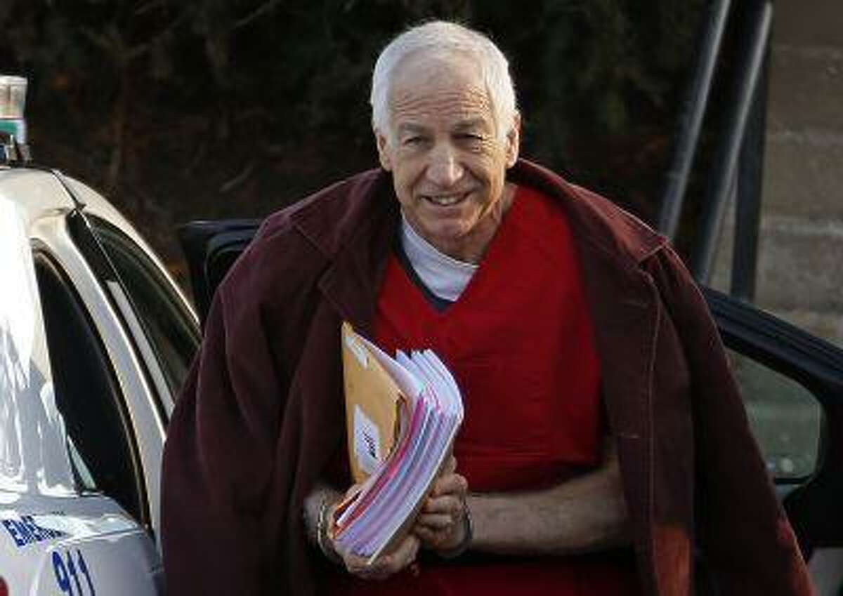 In this Jan. 10, 2013, file photo, former Penn State assistant football coach Jerry Sandusky arrives at the Centre County Courthouse for a post-sentencing hearing in Bellefonte, Pa.