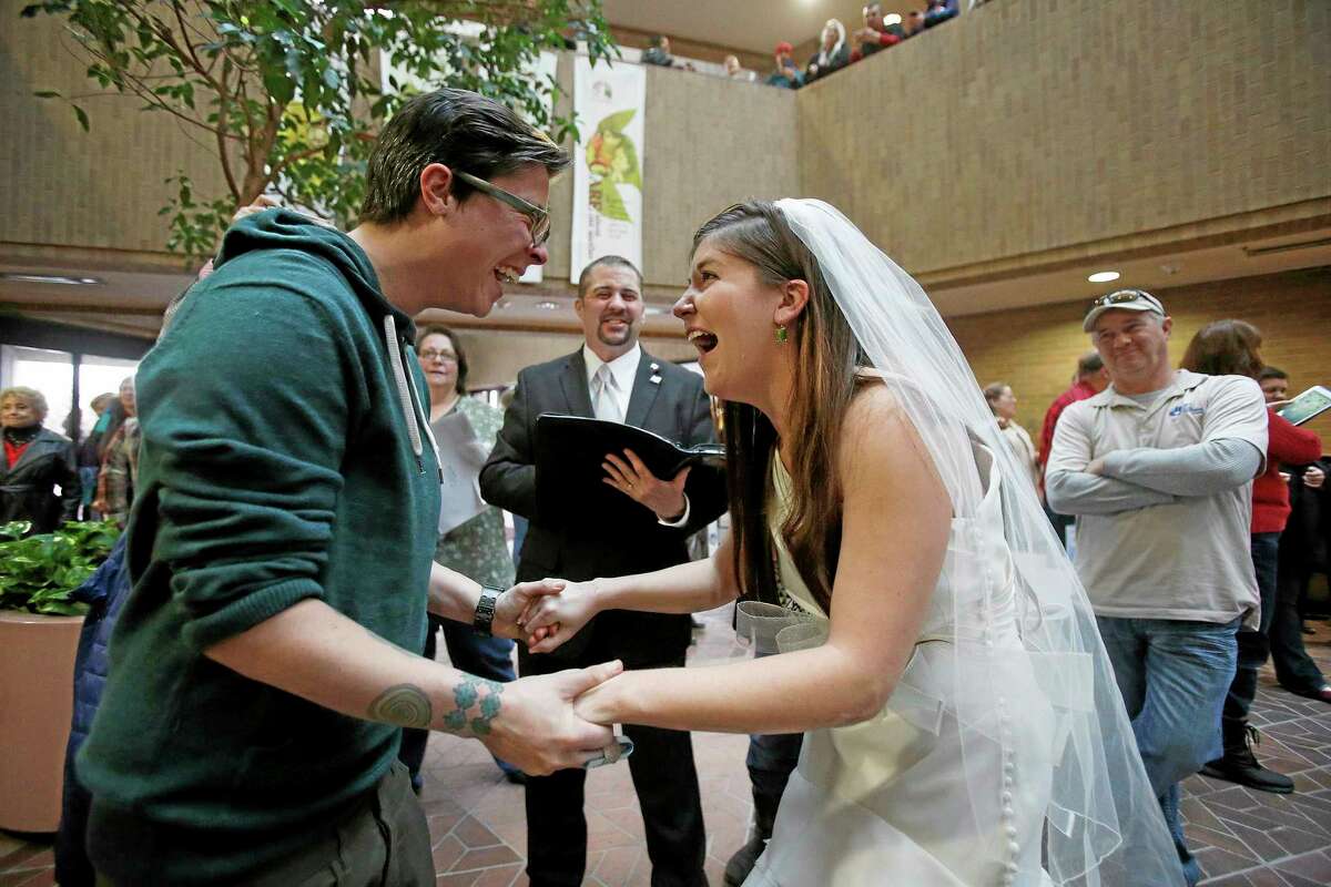 AP photo Jax and Heather Collins get married at the Salt Lake County clerk's office Monday.