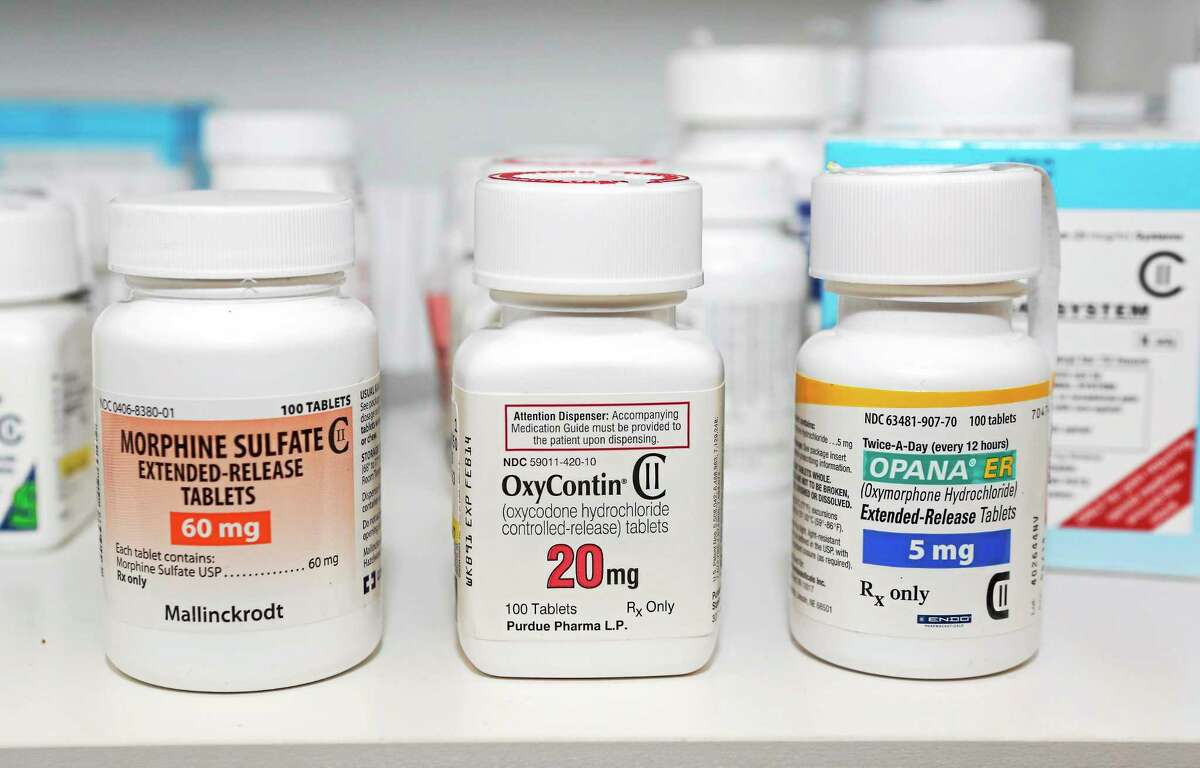 In this photo taken Friday, Jan. 18, 2013, Schedule 2 narcotics Morphine Sulfate, OxyContin and Opana are displayed for a photograph in Carmichael, Calif. Attorney General Kamala Harris is urging lawmakers to approve funding for a control substances prescription tracking program. The computerized database can help track doctors who are overprescribing addictive drugs or patients who visit multiple physicians to get prescription drugs to feed their addictions.