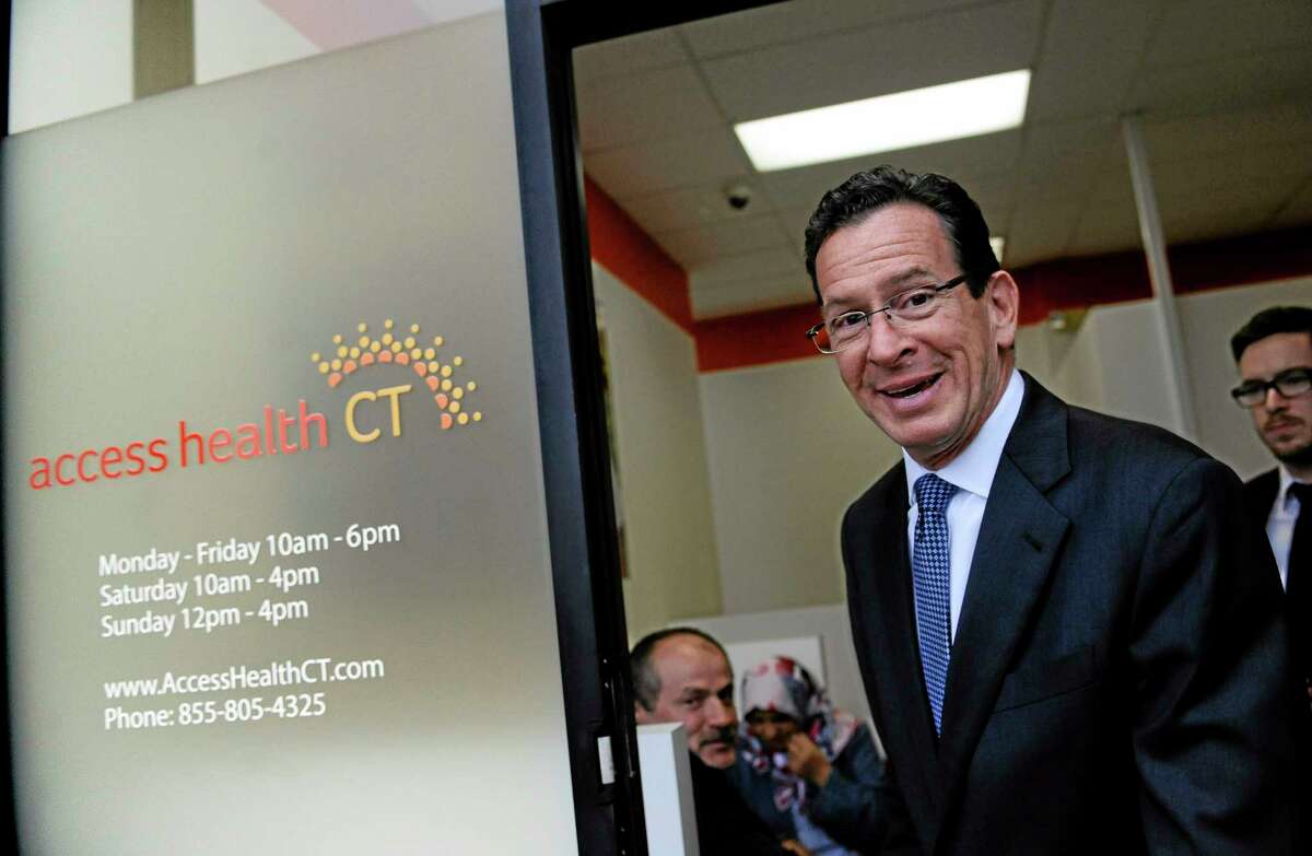 Connecticut Gov. Dannel P. Malloy leaves a grand opening for Connecticut's health insurance exchange's first insurance store, Access Health CT, Thursday, Nov. 7, 2013, in New Britain, Conn. The site, where people can visit to sign up for coverage, is the first in the nation. (AP Photo/Jessica Hill)