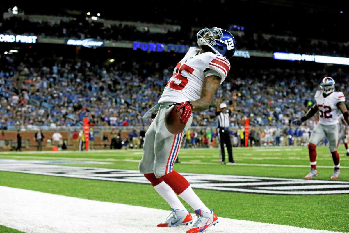 Giants free safety Will Hill (25) reacts after intercepting Lions quarterback Matthew Stafford for a touchdown during the fourth quarter Sunday.