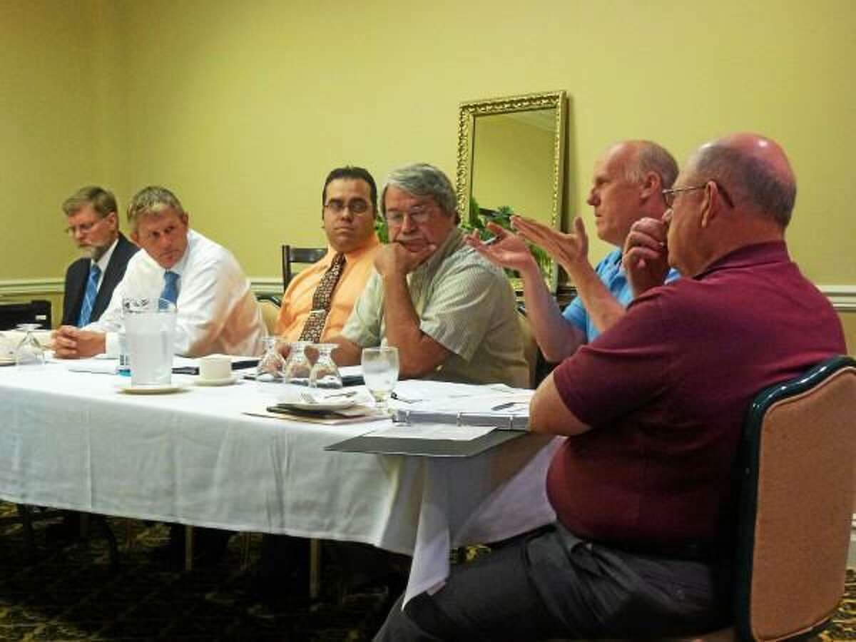 DEEP's Tom Metzner explains new recycling initiatives to Goshen First Selectman Wilrose Duquette, Harwinton First Selectman Michael Criss and other local leaders during an LHCEO meeting on July 12. (Ryan Flynn-Register Citizen)