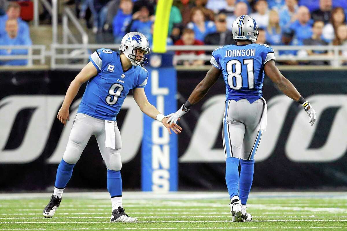Wide receiver Calvin Johnson, quarterback Matthew Stafford (9) and the Lions need to beat the Giants Sunday to help keep their playoff hopes alive.