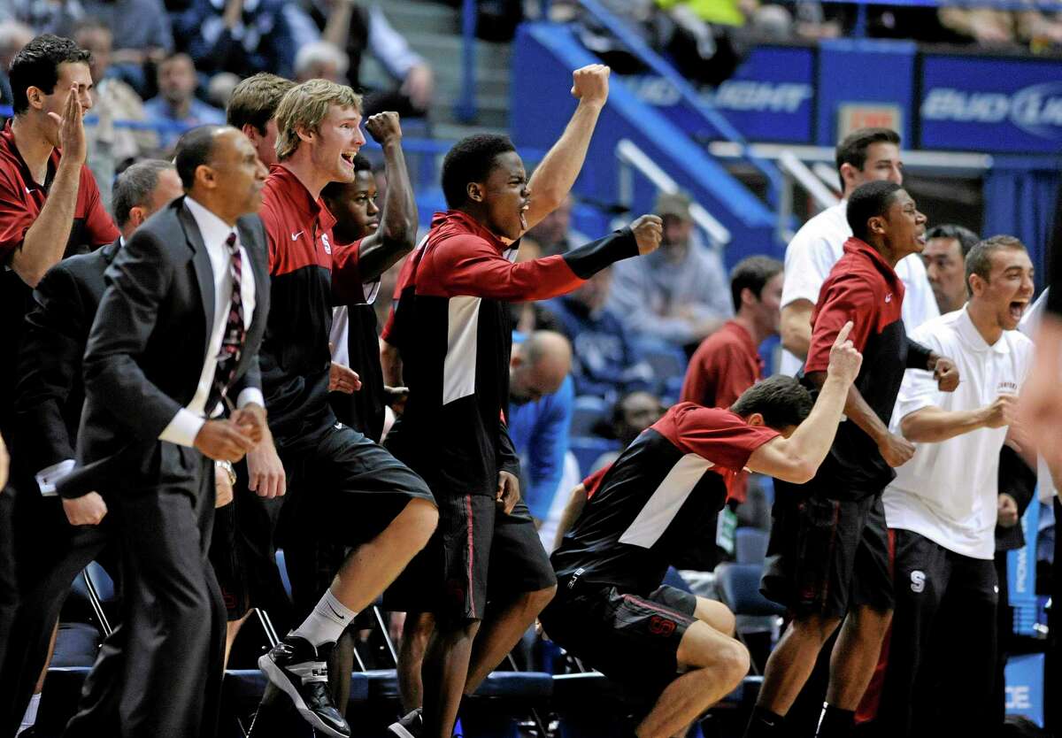 Stanford players celebrate their 53-51 victory over UConn on Wednesday night at the XL Center in Hartford.