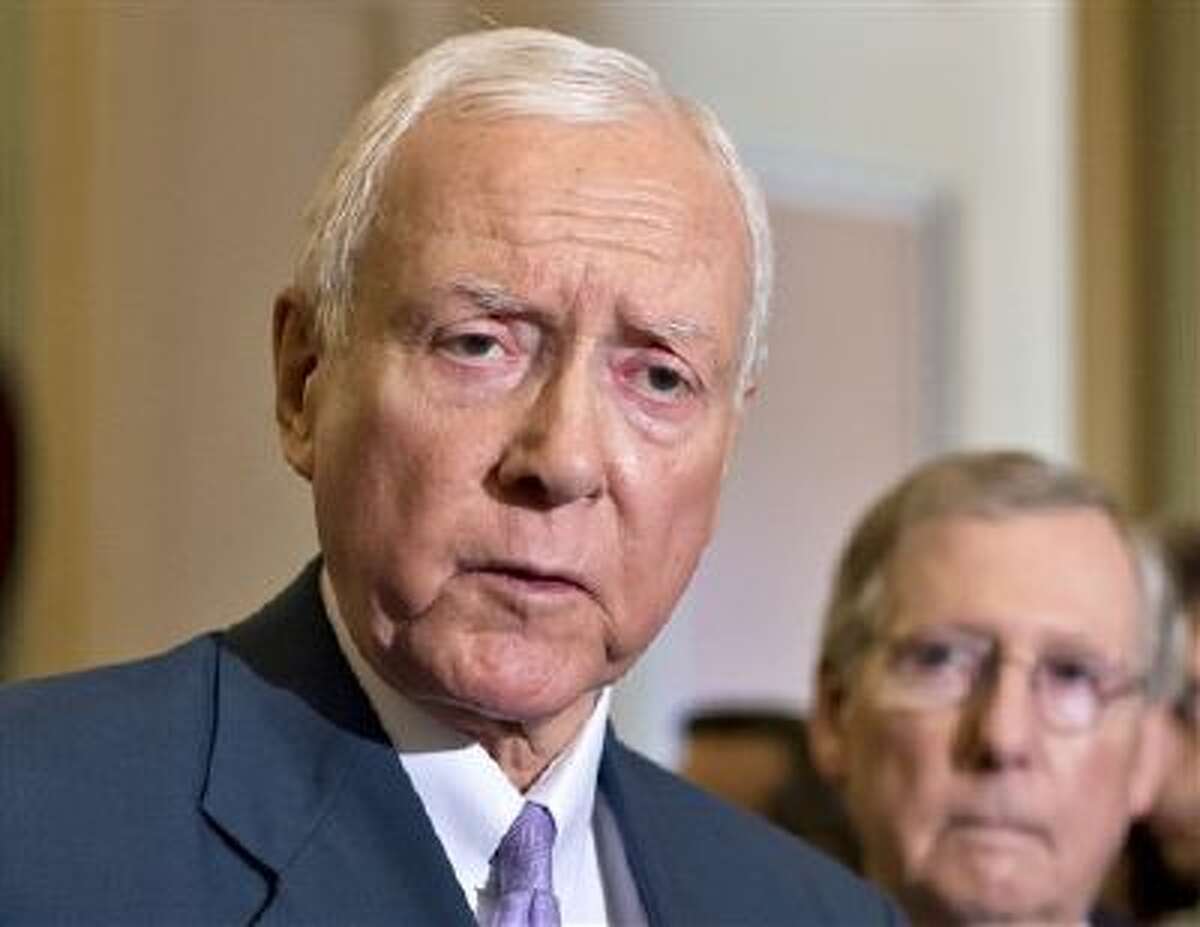 In this July 30, 2013 file photo, Sen. Orrin Hatch, R-Utah, left, accompanied by Senate Minority Leader Mitch McConnell of Ky. speaks with reporters on Capitol Hill in Washington. On Monday, Hatch, Sen. Tom Coburn, R-Okla. and Sen. Richard Burr, R-N.C. proposed repealing the nation's controversial health care law in favor of a Republican replacement. (AP)