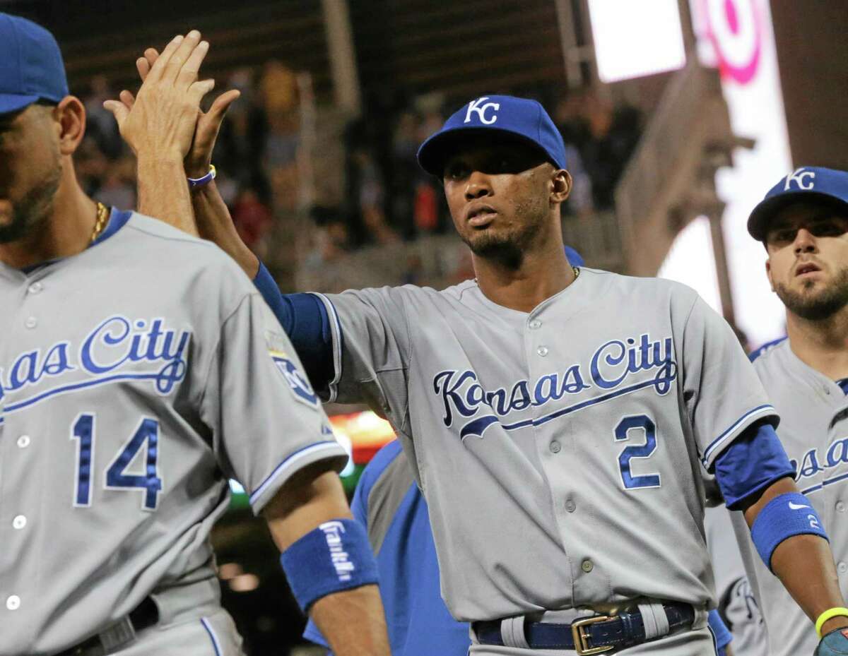 Kansas City shortstop Alcides Escobar (2) goes through the celebration line after the Royals defeated the Minnesota Twins 6-5 on Friday in Minneapolis.