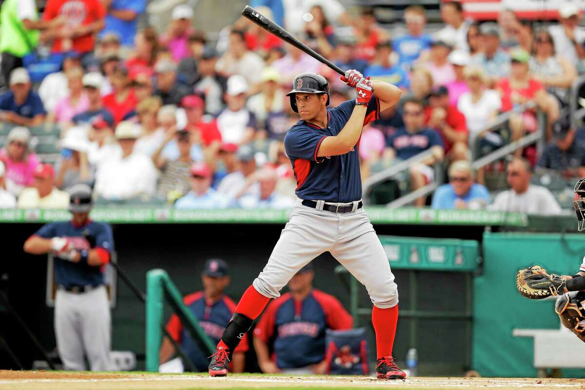 Boston Red Sox third baseman Garin Cecchini bats during the first inning of a spring training game against the Miami Marlins on March 6 in Jupiter, Fla.