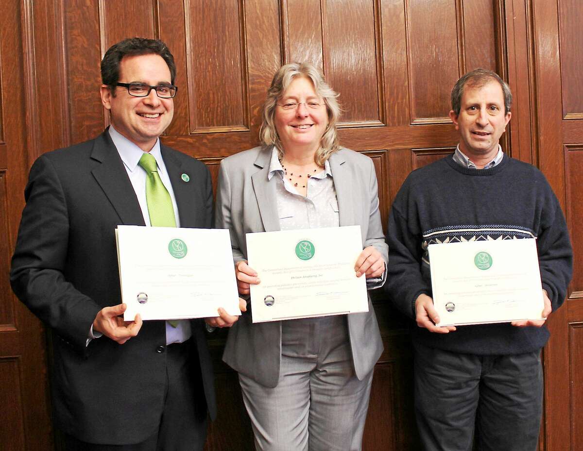Representatives for Aptar pose with their GreenCircle certificates on Tuesday during an award’s ceremony in Hartford.