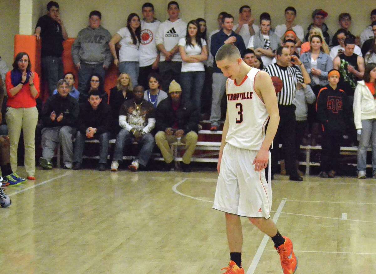 Terryville senior Tyler Trillo walks off his home court for the final time as the Kangaroos are eliminated from the Class S State Tournament, 72-41 against Bloomfield.
