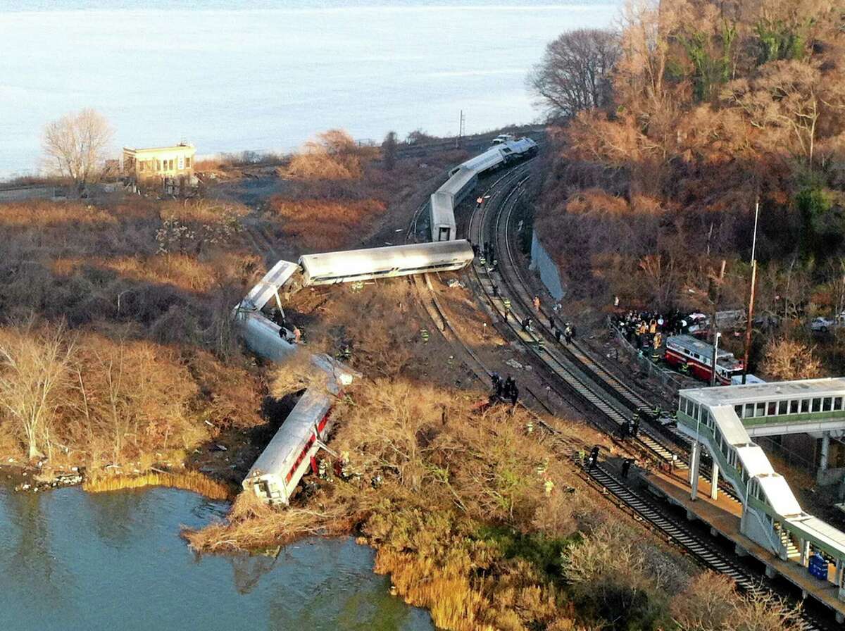 Cars from a Metro-North passenger train are scattered after the train derailed in the Bronx, N.Y., Dec. 1. There were “multiple injuries” in the train derailment. (AP Photo/Edwin Valero)