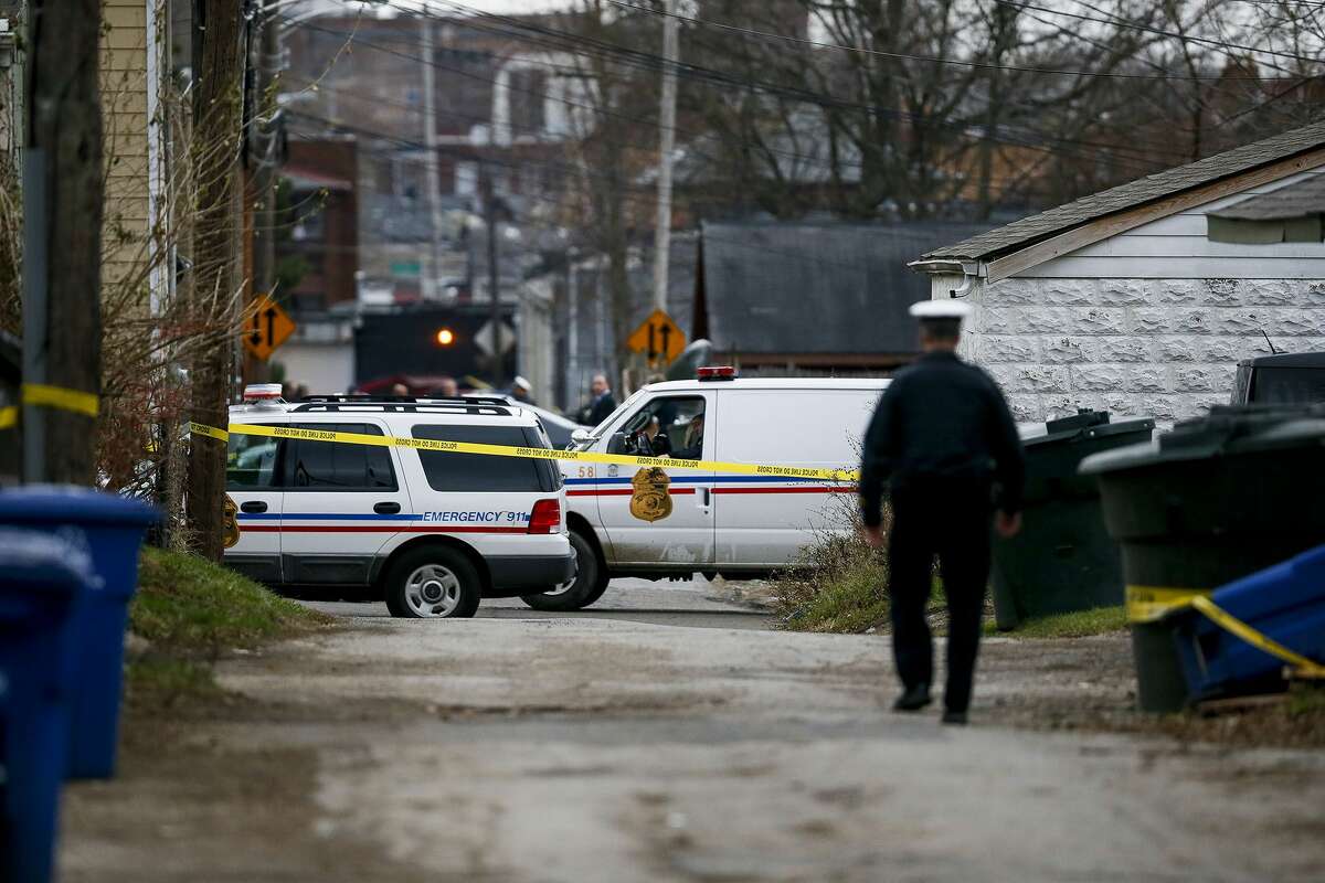 Columbus Police block an alley near 6th Avenue and Cortland Avenue in Columbus, Ohio while investigating the scene where the body of missing Ohio State football player, Kosta Karageorge was discovered in a dumpster on Nov. 30, 2014. According to police, Karageorge died of a self-inflicted gunshot wound.