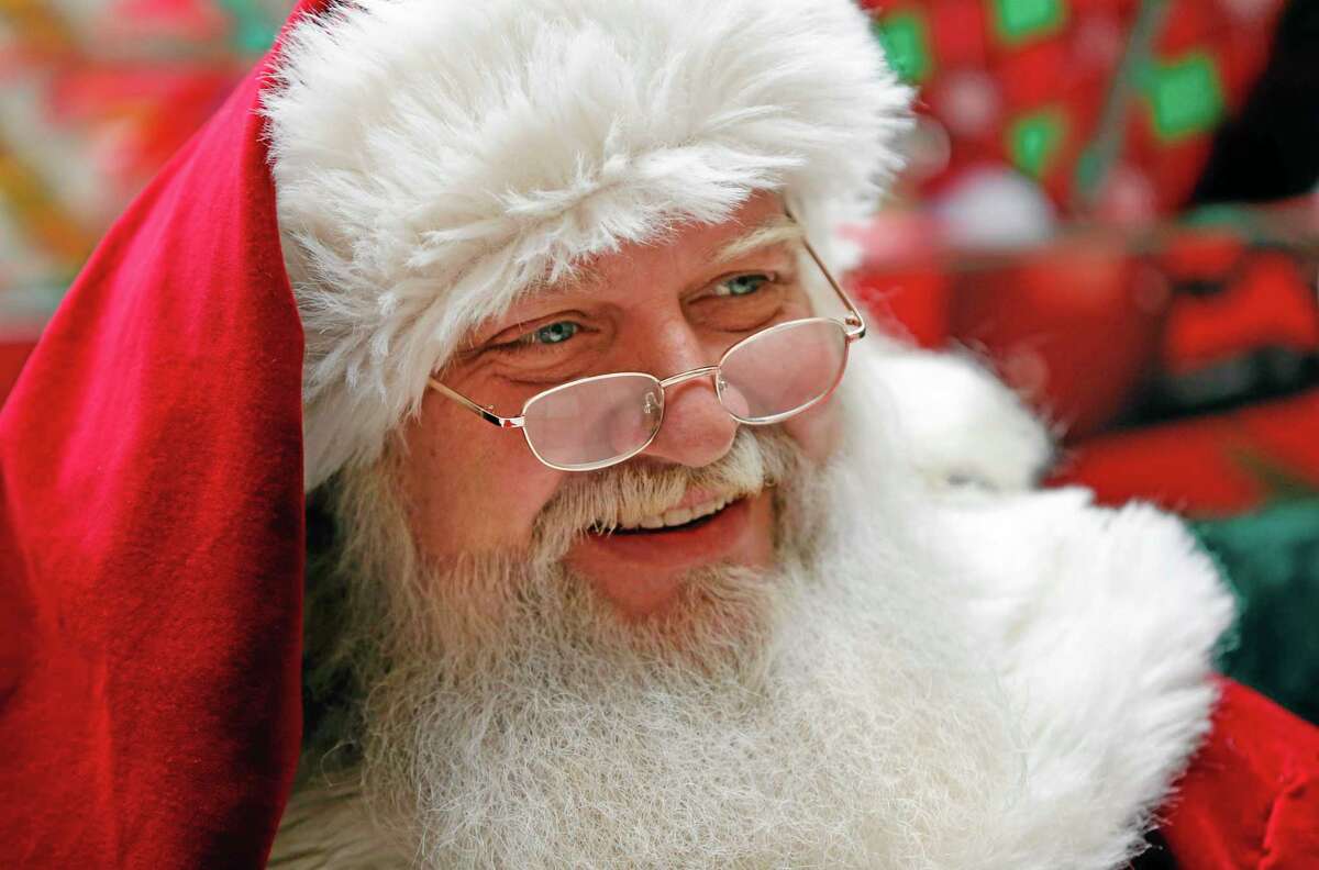 A man portraying Santa Claus sits in a mall in South Portland, Maine on Thursday, Dec. 19, 2013.