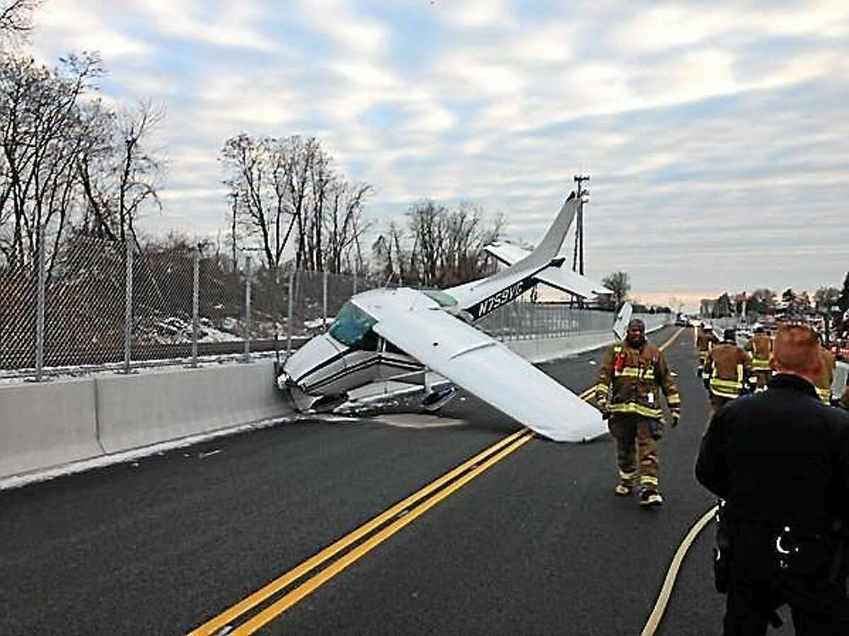 A single-engine plane made an emergency landing on the CTFastrak busway on New Park Avenue in West Hartford November 29, 2014.
