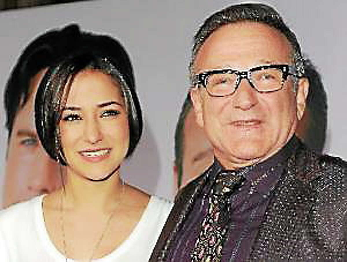 This Nov. 9, 2009, file photo shows Zelda Williams, left, with her father Robin Williams at the premiere of “Old Dogs,” in Los Angeles.