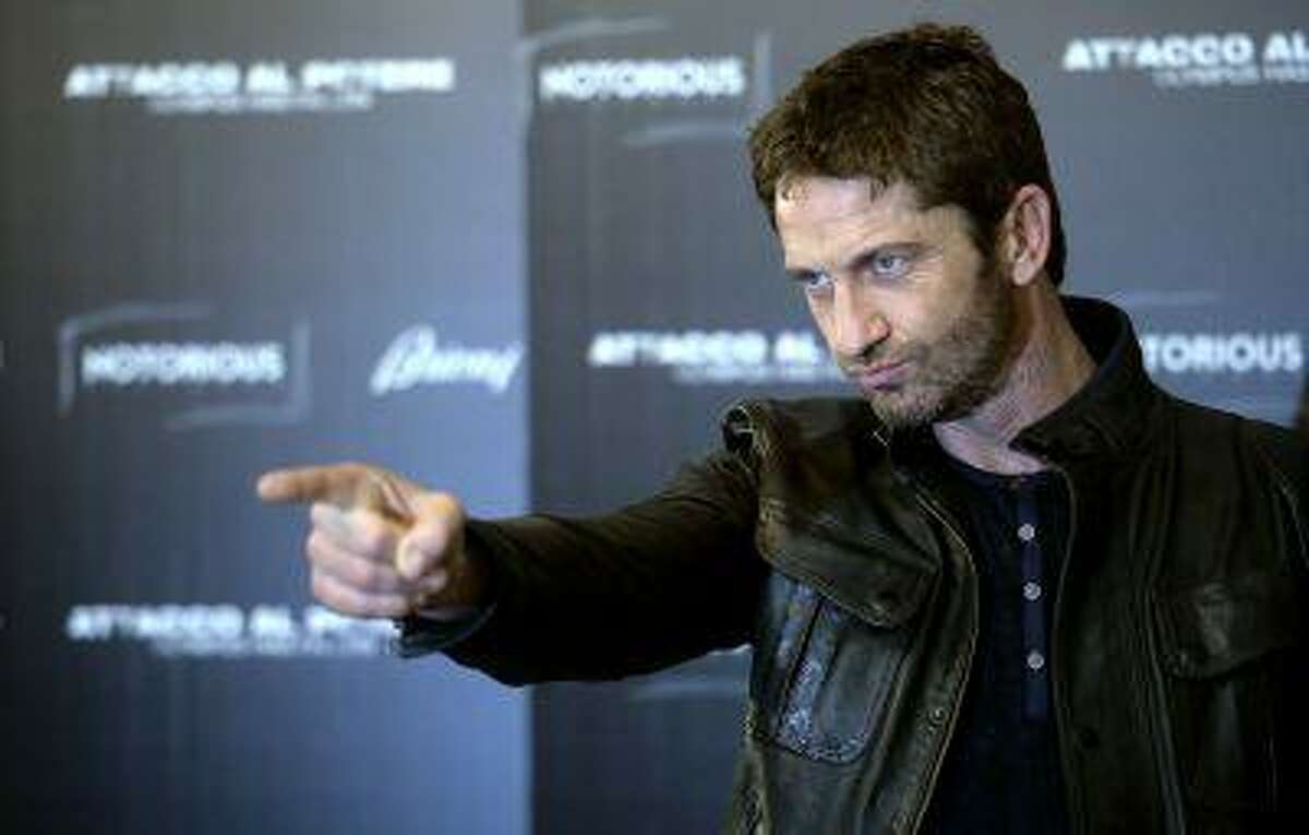 Scottish actor Gerard Butler poses during a photocall for the movie "Olympus has fallen" in downtown Rome on April 5, 2013. AFP PHOTO / Filippo MONTEFORTE (Photo credit should read FILIPPO MONTEFORTE/AFP/Getty Images)