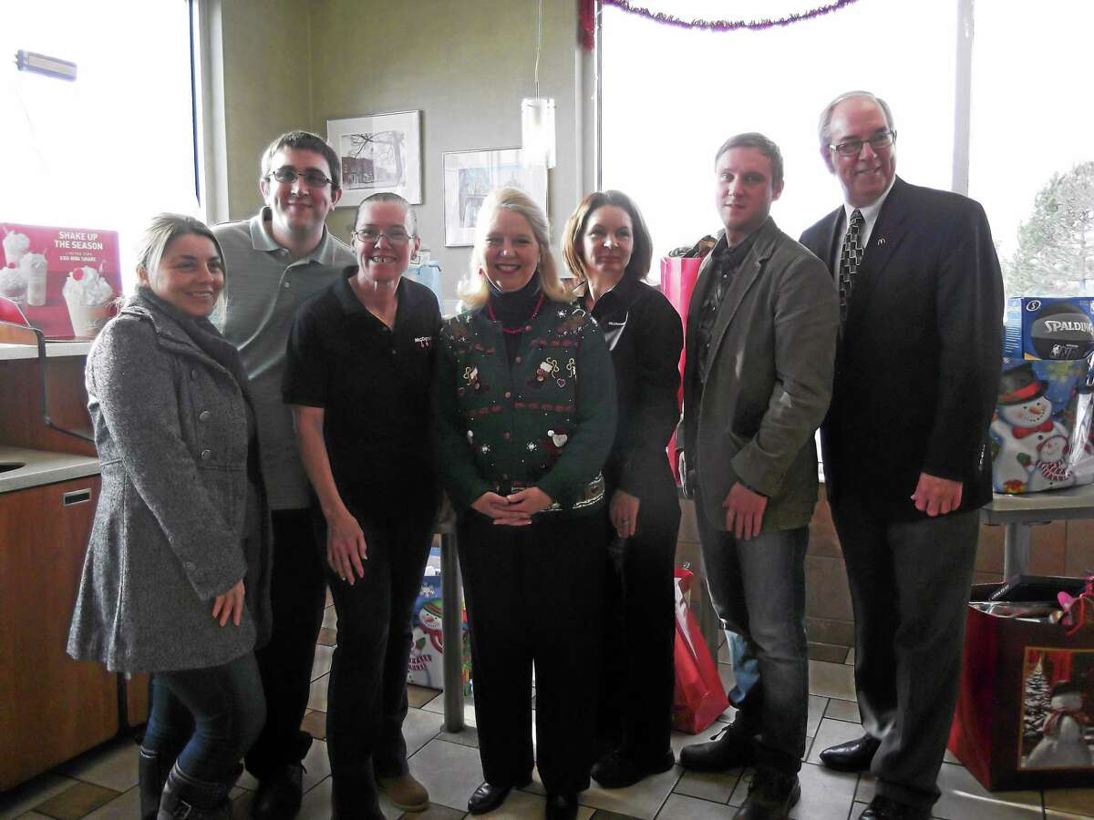 Representatives from F.I.S.H. and McDonald’s collected the toys donated to the homeless shelter for the holiday. (left to right) Vera Halilaj, case manager at FISH; Robbie Licina, shift manager at McDonald’s; Mary Mastrobono, McDonald’s employee; Deirdre DiCara, executive director for FISH; Joanne Cilfone, store manager for McDonald’s; Earl Gibson, case manager at FISH; and Jim McGarry, owner of the East Main St. McDonald’s.