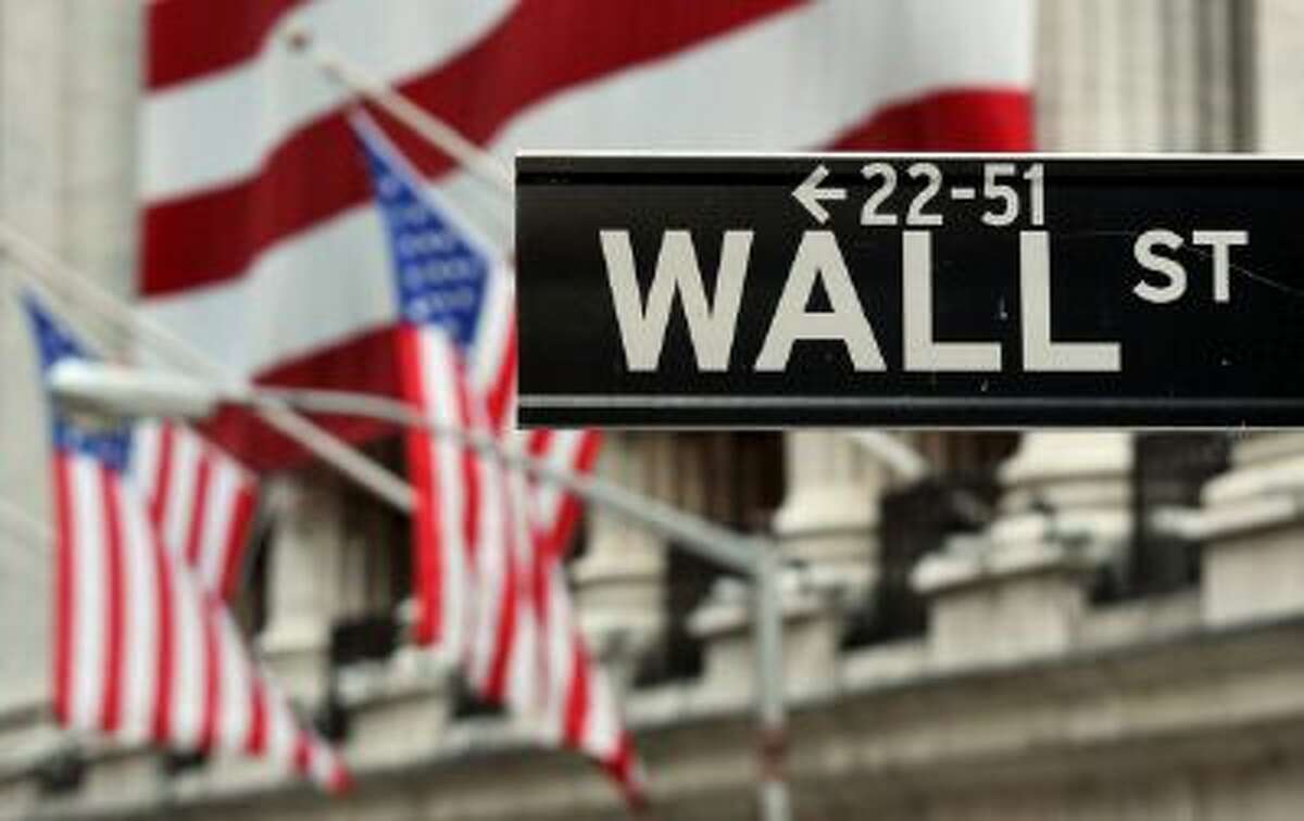The Wall Street sign near the front of the New York Stock Exchange August 5, 2011. AFP PHOTO/Stan HONDA (Photo credit should read STAN HONDA/AFP/Getty Images)