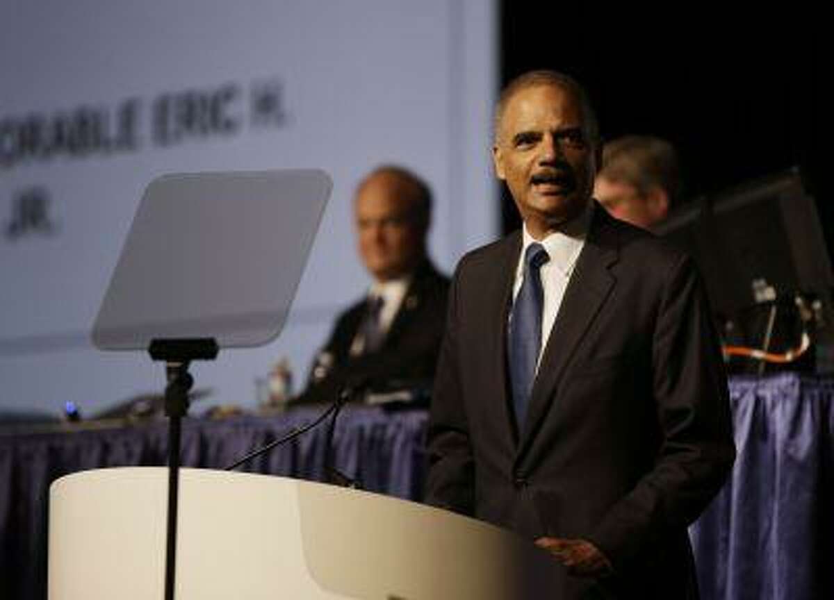 Attorney General Eric Holder speaks to the American Bar Association Annual Meeting Monday, Aug. 12, 2013, in San Francisco. In remarks to the association, Holder said the Obama administration is calling for major changes to the nation's criminal justice system that would cut back the use of harsh sentences for certain drug-related crimes. (AP Photo/Eric Risberg)