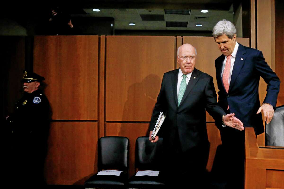 Secretary of State John Kerry walks with Sen. Patrick Leahy, D-Vt. on Capitol Hill in Washington, Thursday, March 13, 2014, prior to Kerry's testimony before the Senate Appropriations subcommittee on Foreign Operations and Related Programs hearing on the State Department's fiscal 2015 budget. In his opening remarks Kerry spoke about Ukraine and other current foreign relation issues. (AP Photo/Charles Dharapak)