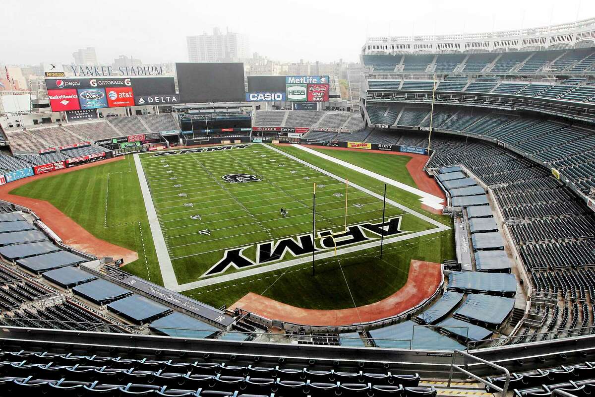 A football field is painted on the field at Yankee Stadium ahead of the Army-Rutgers NCAA college football game, Thursday, Nov. 10, 2011 in New York. The two teams are scheduled to play on Saturday. (AP Photo/Mary Altaffer)