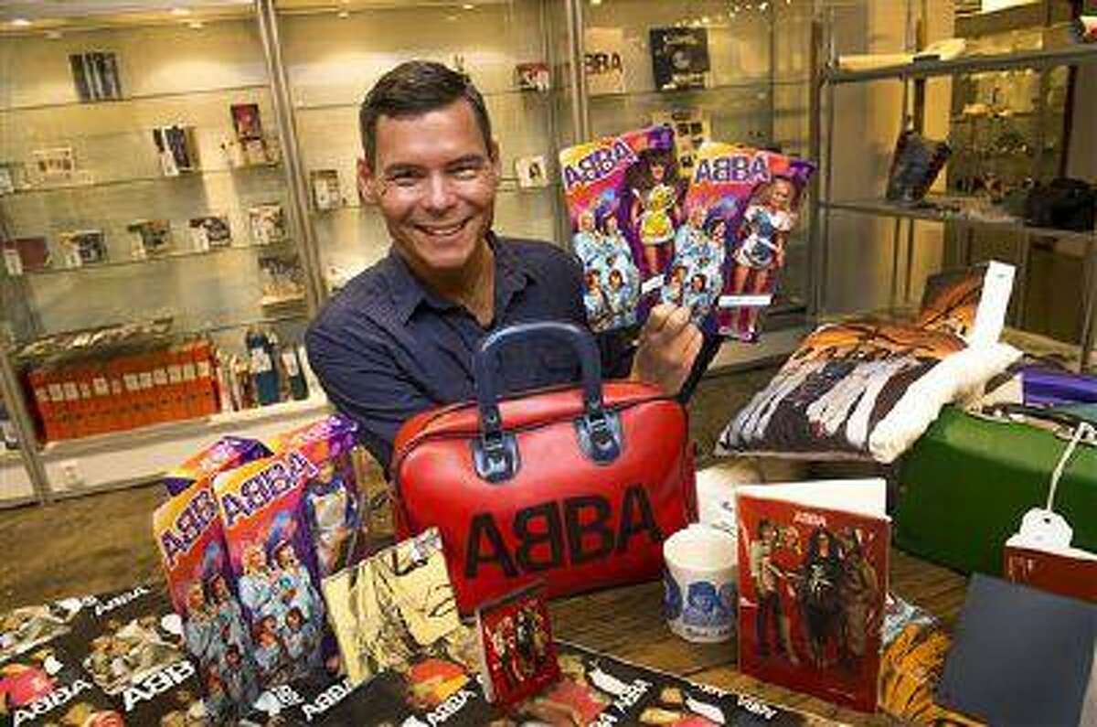 FILE- File photo from June 26, 2013, that shows Tomas Nordin among some of the 25,000 items in his ABBA collection that were sold at Stockholm auction house over the weekend of 10-11 Aug. 2013. Stockholm's Auktionsverk on Monday said the stash of ABBA items sold for 560,000 Swedish kronor ($86,000) (AP photo / Scanpix Sweden /Jonas Ekströmer) ** SWEDEN OUT **
