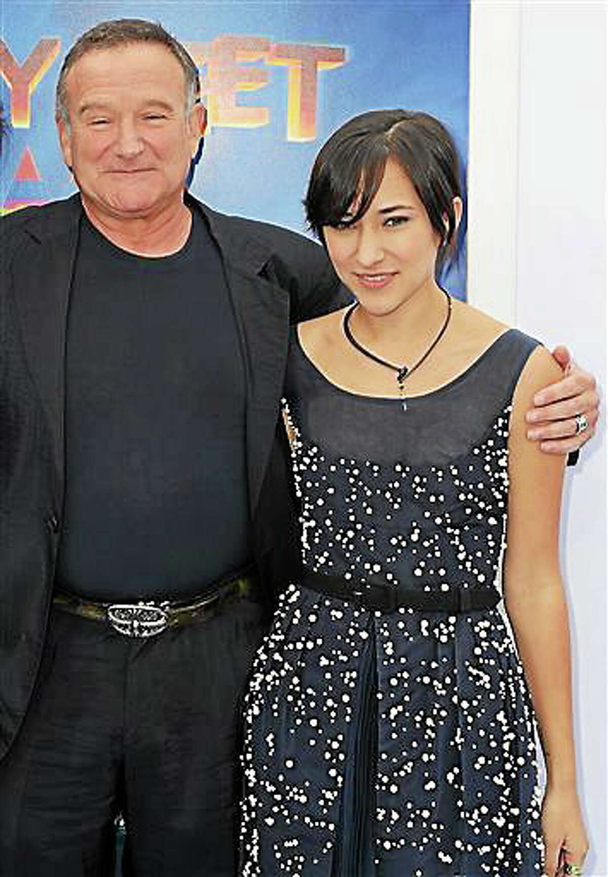 This Nov. 13, 2011, file photo shows actor Robin Williams, left, and his daughter, Zelda, at the premiere of “Happy Feet Two” in Los Angeles. AP Photo/Katy Winn, File