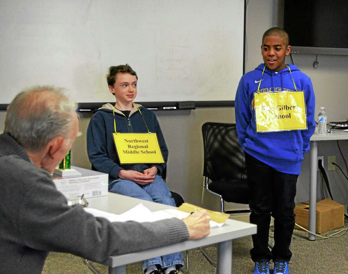 Connor Spencer, left, and Adrian Delacruz, right, compete in the first Register Citizen spelling bee Thursday. Pete Paguaga - The Register Citizen