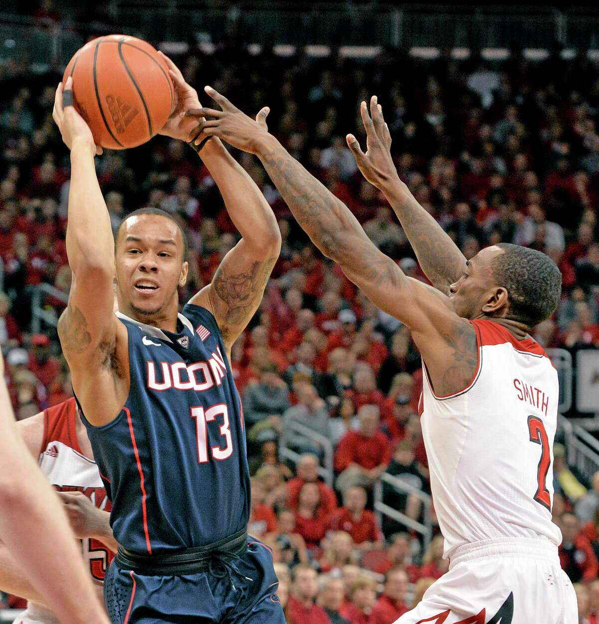 Shabazz Napier, left, edged Louisville’s Russ Smith, right, and Cincinnati’s Sean Kilpatrick for the inaugural American Athletic Conference Player of the Year award.