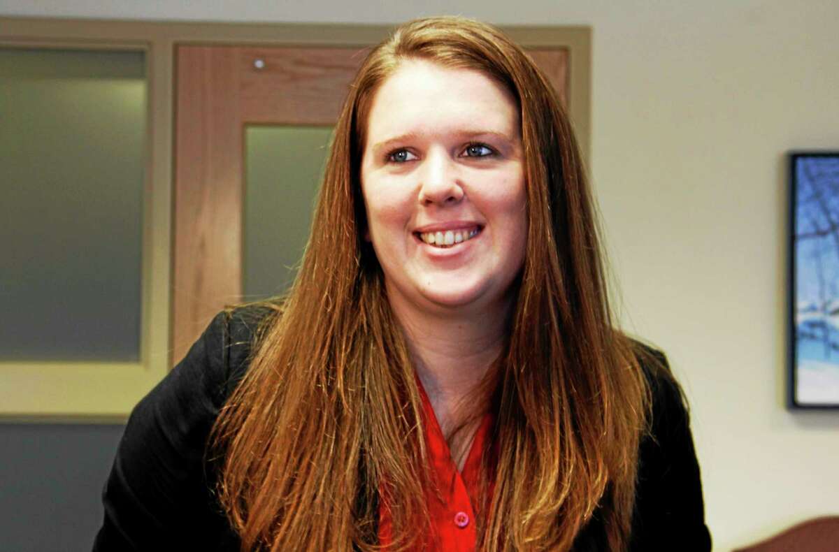 Erin Wilson smiles as she’s introduced as Torrington’s Director of Economic Development on Feb. 10, 2014, at City Hall.