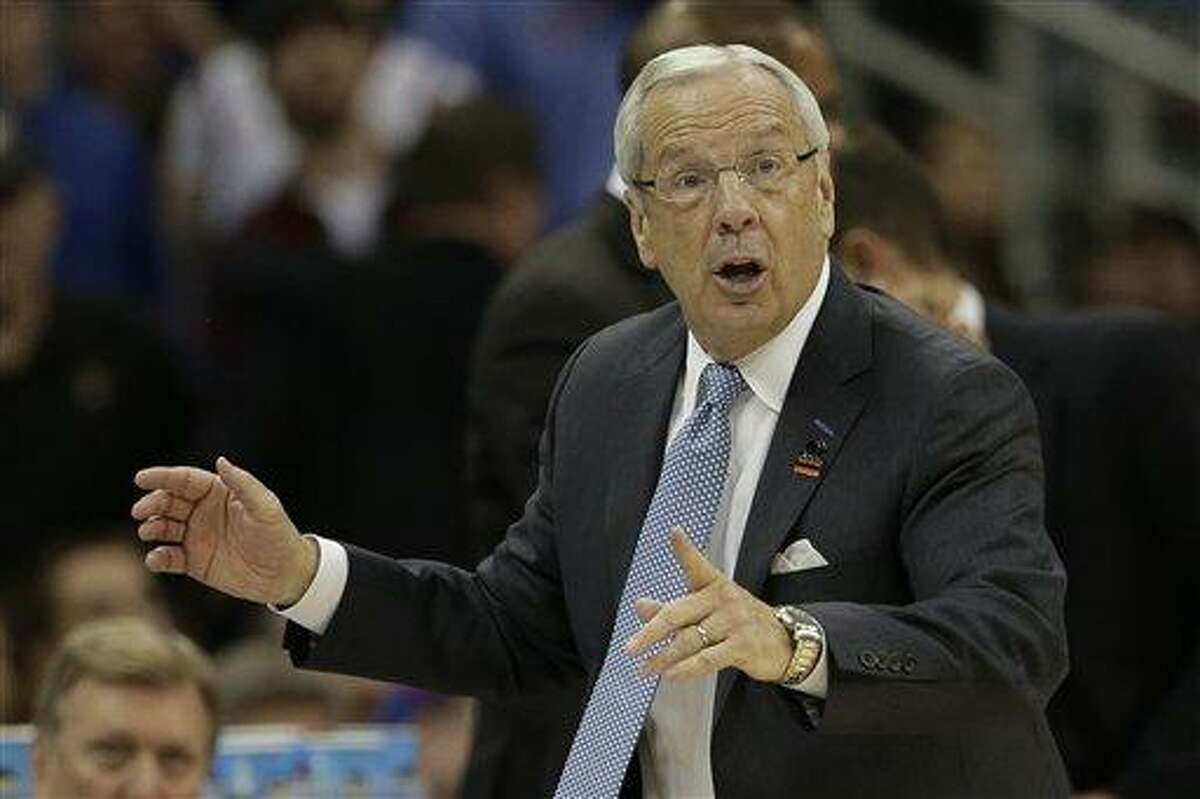 North Carolina coach Roy Williams questions a call during the first half of a third-round game against Kansas in the NCAA college basketball tournament Sunday, March 24, 2013, in Kansas City, Mo. Kansas won the game 70-58. (AP Photo/Charlie Riedel)
