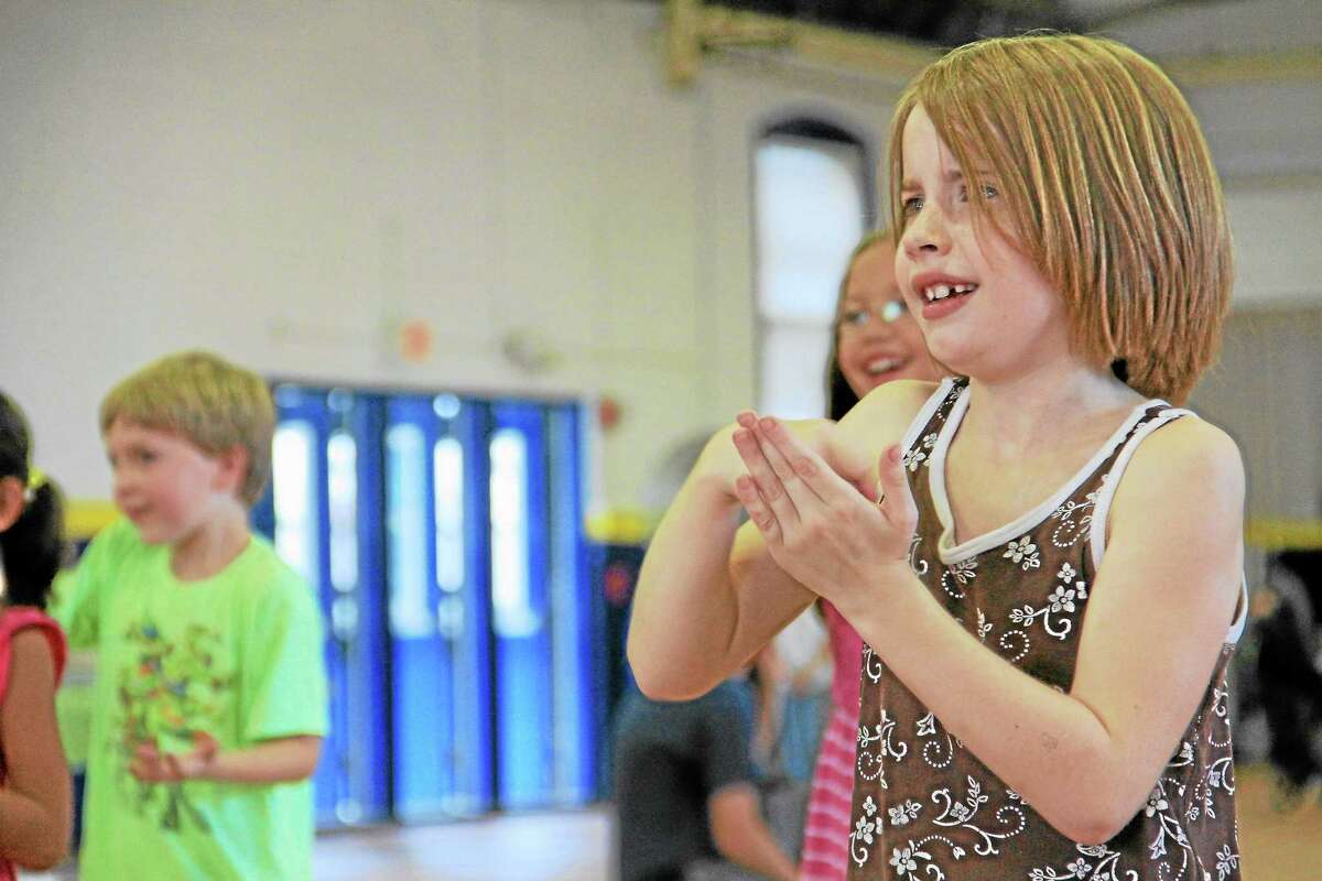 A girl dances during a summer reading party put together by the Torrington Public Library to reward children who were part of a summer reading program.