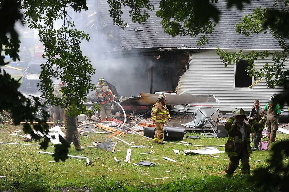 Plane crash in to a house at 64 Charter Oak St in East Haven Friday August 9, 2013 .vmWilliams Ñ Register