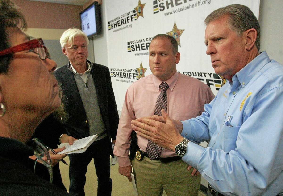 Volusia County Sheriff Ben Johnson , right, with investigator Sgt. Richard Forton, center, talks with the media on Friday March 7, 2014 in Daytona Beach, Fla. Ebony Wilkerson, 32, who drove a minivan carrying her three young children into the ocean surf off Florida, faces attempted murder and other charges Friday, with authorities saying the children were screaming to bystanders that she was trying to kill them. Wilkerson was placed in custody of the sheriff's office Friday after she had been hospitalized for a mental evaluation since Tuesday. Her children were with the Department of Children and Families. Wilkerson faces three counts each of attempted first-degree murder and aggravated child abuse, Johnson said. (AP Photo/The Daytona Beach News-Journal, David Tucker)