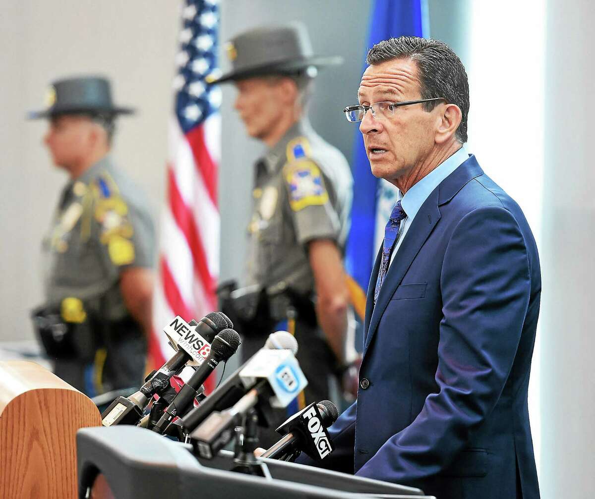 Connecticut Gov. Dannel P. Malloy speaks during an awards ceremony for troopers, local police, federal officers and civilians involved in the Sandy Hook shootings. The awards were held at Rentschler Field in East Hartford in July 2014.