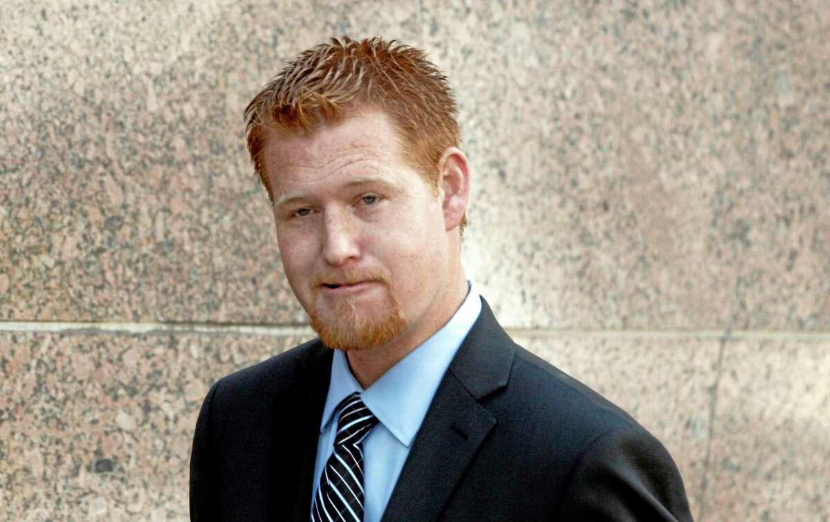 Redmond O'Neal arrives at court Thursday Dec. 12, 2013, to testify in the case of an Andy Warhol portrait of Farrah Fawcett in Los Angeles. Attorneys for Ryan OíNeal concluded their case in the actorís bid to keep a version of the portrait of Fawcett on Thursday. The former coupleís son Redmond, was among the final witnesses. The University of Texas at Austin is suing Ryan O'Neal to try to gain possession of the portrait. Fawcett left all her artwork to the school and it claims O'Neal improperly took it from her condo days after her death. (AP Photo/Nick Ut)
