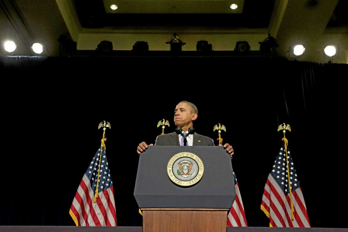 President Barack Obama pauses while speaking at the House Democratic Issues Conference in Cambridge, Md. Friday, Feb. 14, 2014. The president said top priorities for Congress should be increasing the minimum wage and reforming immigration. Obama told a House Democratic retreat Friday that the party needs to stand up for the American dream of getting ahead. (AP Photo/Jacquelyn Martin)